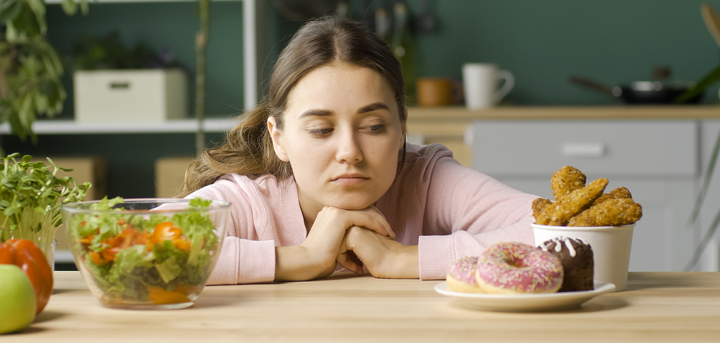 woman-kitchen-chooses-healthy-organic-food-glazed-donuts