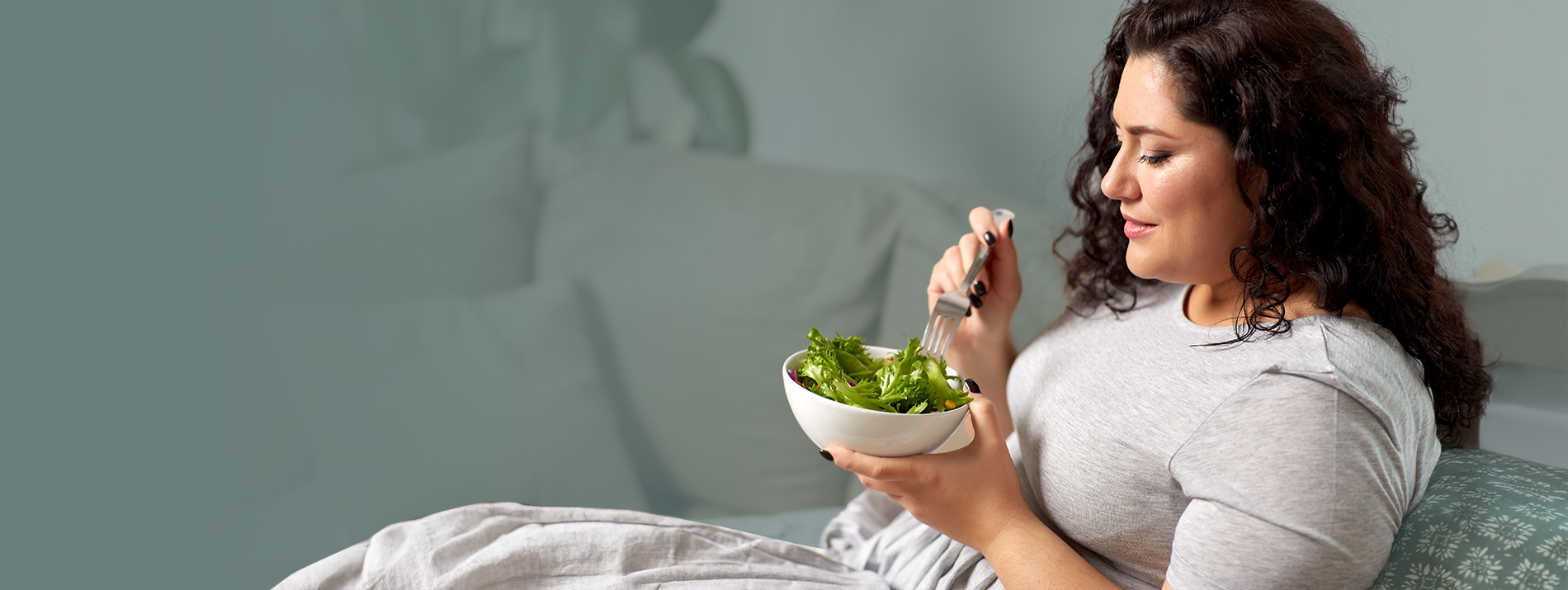 Three women walking together outdoors on a sunny day, enjoying each other’s company.